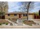 Charming single-story brick home with well-maintained landscaping and a welcoming front entrance at 6020 Quail St, Arvada, CO 80004