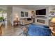 Cozy living room features a modern fireplace, large-screen TV, and comfortable seating at 6020 Quail St, Arvada, CO 80004