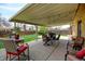 Inviting covered patio with a dining set and cozy decor for enjoyable outdoor living at 6020 Quail St, Arvada, CO 80004
