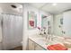 Bathroom with a single sink vanity, framed mirror, and shower/tub combination at 7250 Eastmoor Dr # 203, Denver, CO 80237