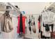 Walk in closet with ample storage shelving and hanging racks at 7250 Eastmoor Dr # 203, Denver, CO 80237