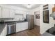 Well-lit kitchen featuring stainless steel appliances and modern countertops at 7250 Eastmoor Dr # 203, Denver, CO 80237