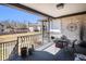 Covered patio with metal railing, room for entertaining and views of the surrounding neighborhood at 7250 Eastmoor Dr # 203, Denver, CO 80237