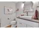 Stylish powder room featuring modern vanity with vessel sink and decorative mirror and wall art at 45 Jackson St # C, Denver, CO 80206