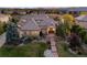 Luxury home with stone accents and mountain views at sunset at 774 Chamberlain Way, Highlands Ranch, CO 80126