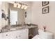 Elegant bathroom with granite countertop, updated fixtures, and a large mirror at 774 Chamberlain Way, Highlands Ranch, CO 80126