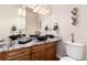 Elegant bathroom with dual sinks, granite countertops, and modern fixtures at 774 Chamberlain Way, Highlands Ranch, CO 80126