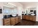 Large bathroom with double sinks, granite counters, and dark wood cabinets at 774 Chamberlain Way, Highlands Ranch, CO 80126