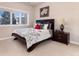 Charming bedroom with a comfortable bed and ample natural light at 774 Chamberlain Way, Highlands Ranch, CO 80126