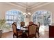 Elegant dining room with large windows and chandelier at 774 Chamberlain Way, Highlands Ranch, CO 80126