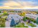 Stunning exterior showcasing mature landscaping, mountain views, and a tile roof against a vibrant sunset at 774 Chamberlain Way, Highlands Ranch, CO 80126