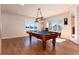 Basement game room with pool table and hardwood floors at 774 Chamberlain Way, Highlands Ranch, CO 80126