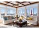 Sunlit living room with vaulted ceiling, hardwood floors, and comfy seating at 774 Chamberlain Way, Highlands Ranch, CO 80126