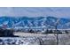 Snowy mountain range in background, houses in foreground at 774 Chamberlain Way, Highlands Ranch, CO 80126