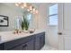 Elegant bathroom with double vanity and large mirror at 1714 Peak Loop, Broomfield, CO 80023