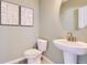 Small powder room with pedestal sink and simple decor at 1714 Peak Loop, Broomfield, CO 80023