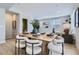 Open dining area with wood table and modern chairs at 1714 Peak Loop, Broomfield, CO 80023