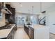 Modern kitchen featuring a large island and stainless steel appliances at 1714 Peak Loop, Broomfield, CO 80023