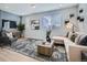 Living room with comfy sectional sofa and accent chair at 1714 Peak Loop, Broomfield, CO 80023