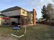 Spacious backyard with a patio, grill, and grassy area for outdoor activities and relaxation at 16119 E Prentice Ln, Centennial, CO 80015