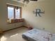 A bedroom with a bed, a window, a chair, and a toy organizer at 16119 E Prentice Ln, Centennial, CO 80015