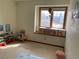 Bedroom featuring a large window and carpeted floor at 16119 E Prentice Ln, Centennial, CO 80015