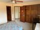 Bedroom with a wooden closet, neutral carpet, and a view to another room at 16119 E Prentice Ln, Centennial, CO 80015