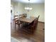 Dining room with seating for eight and hardwood floors at 16119 E Prentice Ln, Centennial, CO 80015