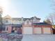 Charming two-story home featuring a three car garage and brick accents at 16119 E Prentice Ln, Centennial, CO 80015