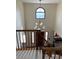 View of the foyer from the stairs shows a bright entryway with a large chandelier at 16119 E Prentice Ln, Centennial, CO 80015