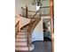 Grand foyer with a curved staircase, wood railings, and tile flooring at 16119 E Prentice Ln, Centennial, CO 80015