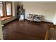 Bright sitting room boasts hardwood floors and a large bay window at 16119 E Prentice Ln, Centennial, CO 80015