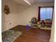 Spacious playroom featuring vinyl wood floors and a large window at 16119 E Prentice Ln, Centennial, CO 80015