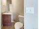 Cozy bathroom showcasing a modern vanity with sink, and a toilet with a clean, minimalist design at 2258 Whistler Dr, Longmont, CO 80504