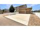 Well-maintained two-story home showcasing a spacious driveway and an attached three-car garage at 2258 Whistler Dr, Longmont, CO 80504