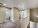 Upstairs landing hallway features neutral tones and leads to bedroom and bathroom at 2258 Whistler Dr, Longmont, CO 80504