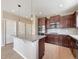 Modern kitchen with granite countertops, stainless steel appliances, and ample cabinetry at 2258 Whistler Dr, Longmont, CO 80504