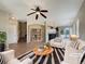 Bright living room featuring hardwood floors, fireplace, and stylish decor at 2258 Whistler Dr, Longmont, CO 80504