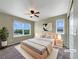Bedroom showcasing natural light, neutral color palette, and plush carpeting at 2258 Whistler Dr, Longmont, CO 80504