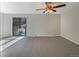 Spacious bedroom with a ceiling fan and sliding door access to balcony at 750 Tabor St # 18, Lakewood, CO 80401