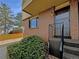 Brick townhouse exterior with stairs and landscaping at 750 Tabor St # 18, Lakewood, CO 80401