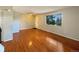 Living room with hardwood floors and access to the hallway at 750 Tabor St # 18, Lakewood, CO 80401