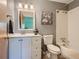 Bright bathroom with a white vanity, framed mirror, and a shower-tub combination, offering a clean and functional design at 12348 Quartz Spur, Conifer, CO 80433