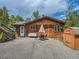 Cozy home with a welcoming front yard, dining set, and convenient storage shed at 12348 Quartz Spur, Conifer, CO 80433