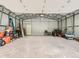 Spacious garage/storage building with high ceilings, ready for all your projects, vehicles, and storage needs at 12348 Quartz Spur, Conifer, CO 80433