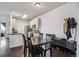 Open dining room and kitchen with stainless steel appliances, and ample storage space at 14221 E 1St Dr # 208, Aurora, CO 80011