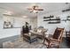 Open-concept living space with hardwood floors and a smooth transition to the kitchen and dining area at 14221 E 1St Dr # 208, Aurora, CO 80011