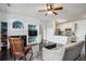 Open concept living room and kitchen layout with white walls and lots of natural light at 14221 E 1St Dr # 208, Aurora, CO 80011