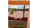 View of a parking lot from a window, with some landscaping and mountains in the distance at 14221 E 1St Dr # 208, Aurora, CO 80011