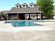 Inviting community pool with a covered pavilion and comfortable lounge seating at 14221 E 1St Dr # 208, Aurora, CO 80011